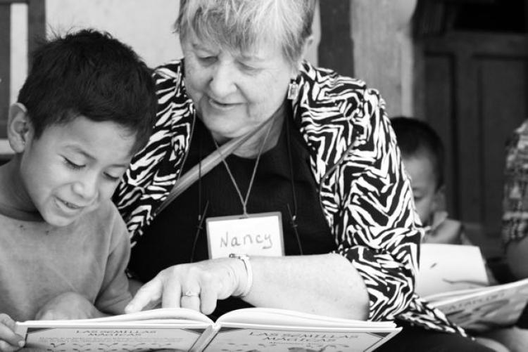 Nancy Kellogg with Reading Village student