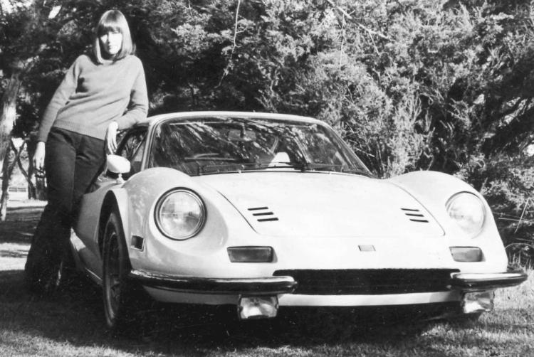 Image of Barbara Jean standing next to sports car coupe