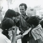 Barry Thomas shared Spanish-language health and nutrition books with a group of students at a summer program in Longmont. (Daily Camera Collection, CU Heritage Center)