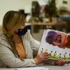 Tutor reading to children 