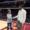 Kevin Love with a fan at a basketball game