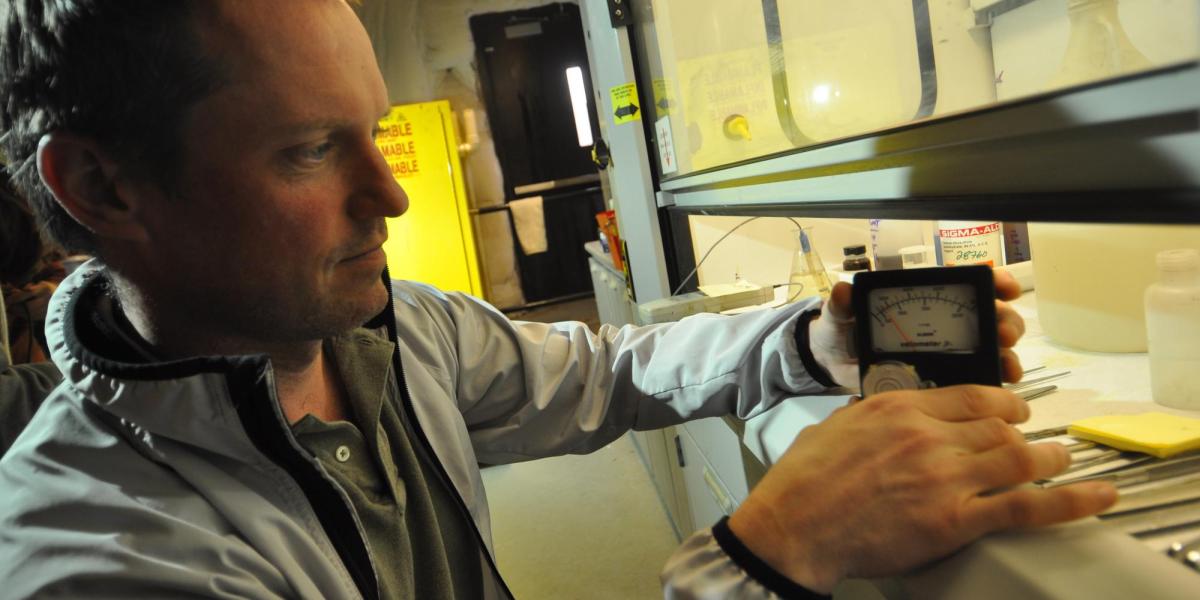 A man taking a reading in a lab