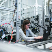 woman in an engineering field sitting at a desk