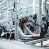 woman in an engineering field sitting at a desk