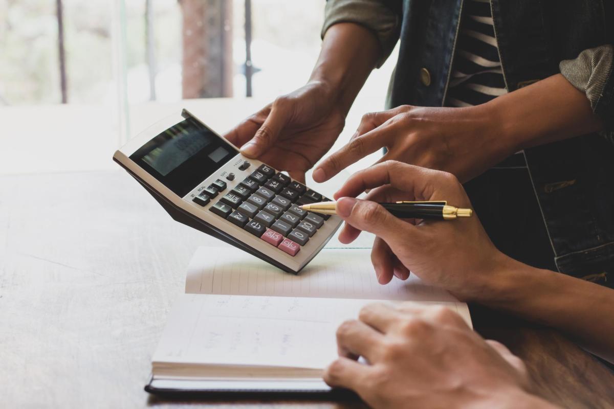 hands with a calculator