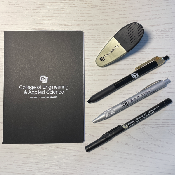 Various branded swag; notebooks, pens, magnet clip