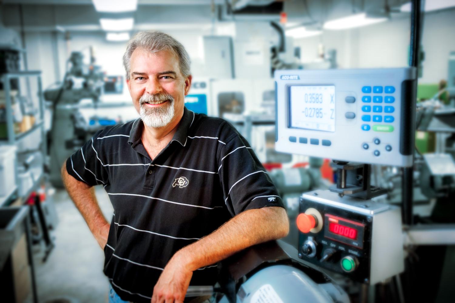 Greg Potts leads on a piece of machine-shop equipment