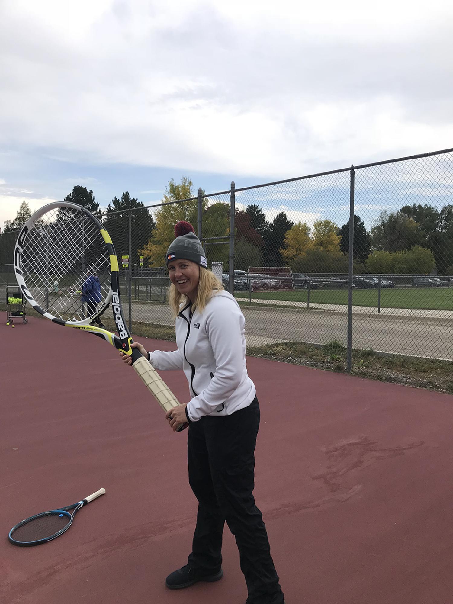 Karen Crofton with an oversized tennis racket