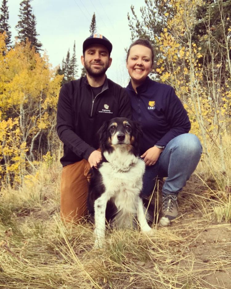 Josh with his wife and their dog