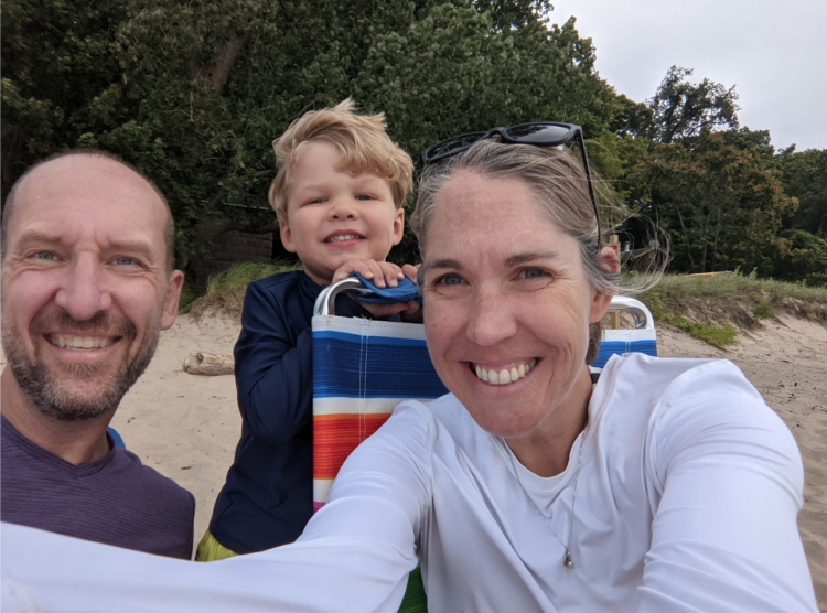 Becky Komarek with husband and son at the beach