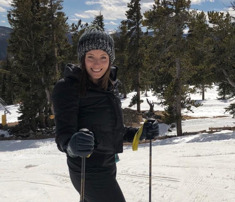 Female on skis in moutains