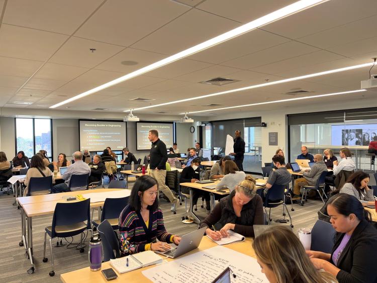 Groups of attendees work together during the education session on Nov. 11