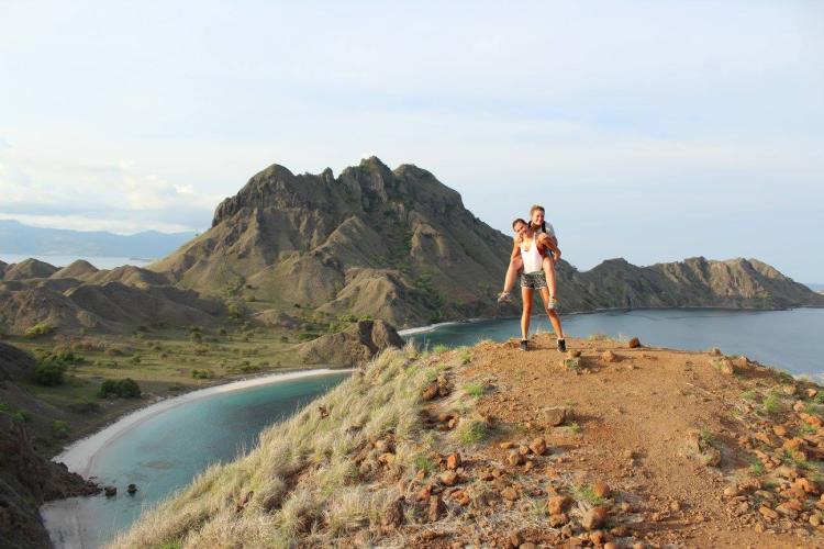 Kiki Garthwaite (TAM) and Elise Brizes (ChemBio) summit Palau Padar in Komodo National Park, Indonesia