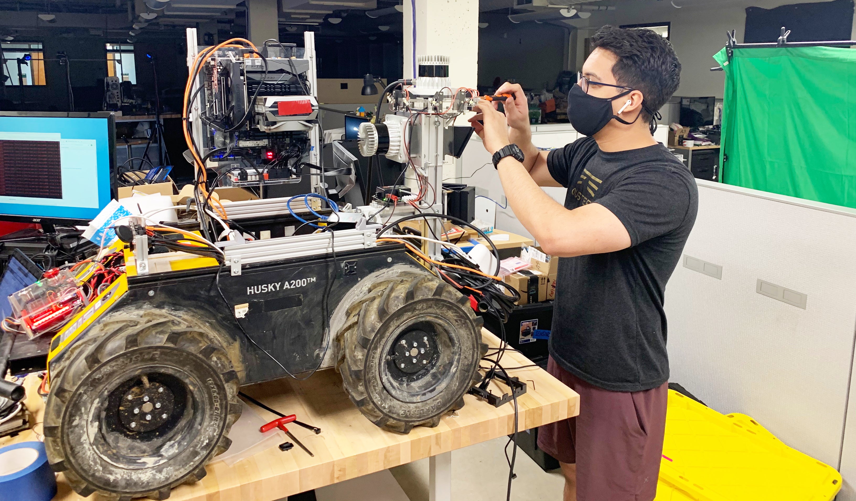 Master's student Dan Torres works on a robotics project in the lab. 