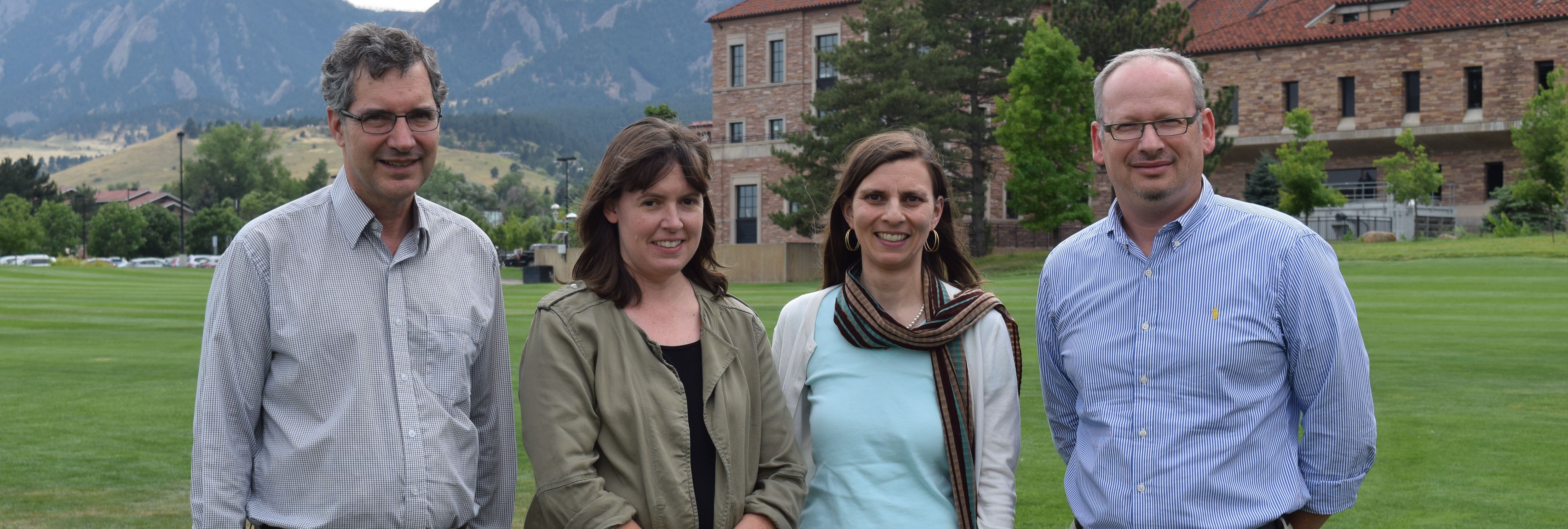 Restrepo, Gibson, Gopinath and Bright on the Business Field, with the Flatirons in the background