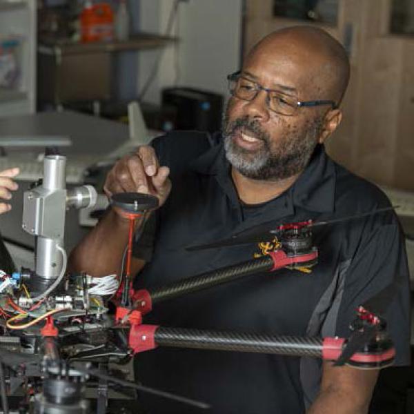 Brian Argrow and student in lab