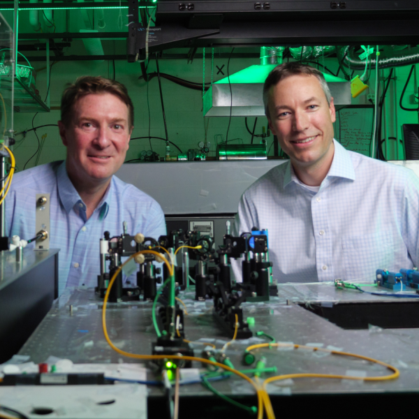 Quantum Engineering Initiative lead Greg Rieker, right, with Scott Diddams in the lab.