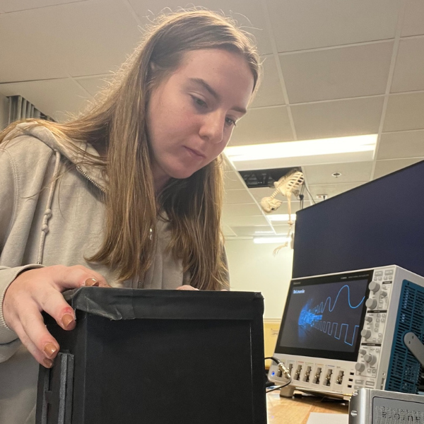 Abby Adams in the lab with a computer