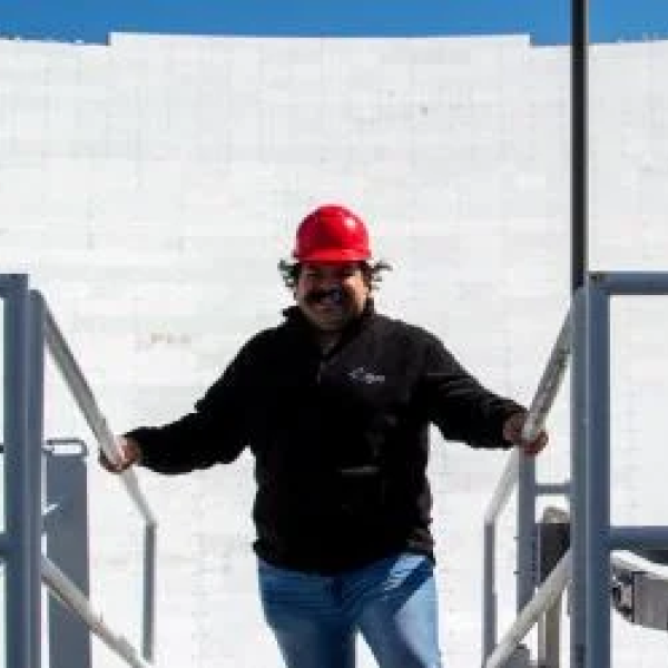 Hernandez facing his fear of heights on a tour of the 100-meter diameter Green Bank Telescope (GBT). Image Credit: NSF/AUI/GBO