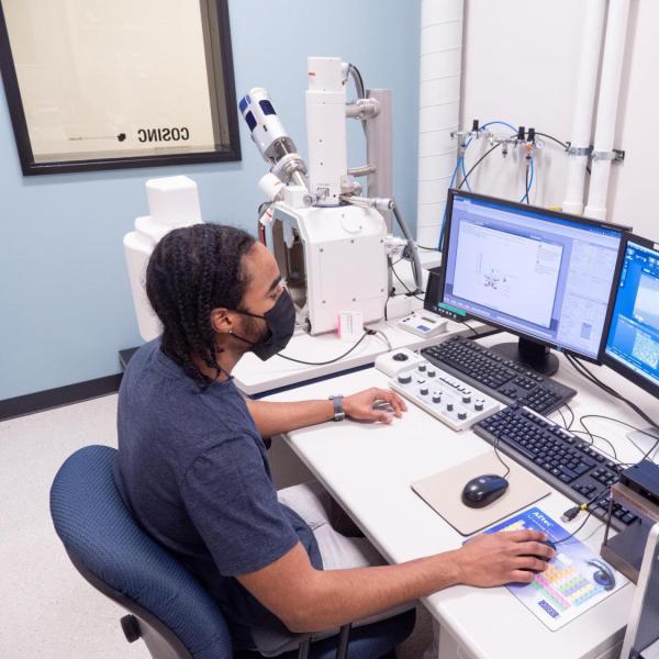 Student Jared Lewis operating an Ultim Max EDS detector.