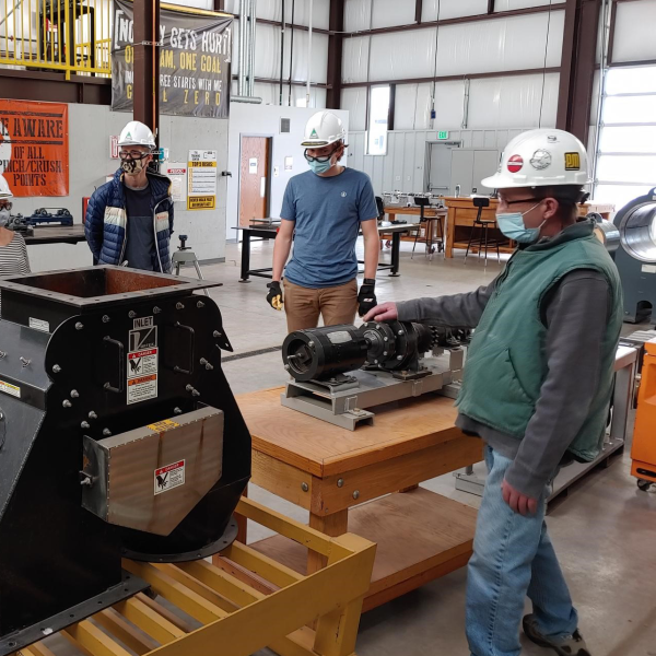 Kiewit scholars in a manufacturing shop