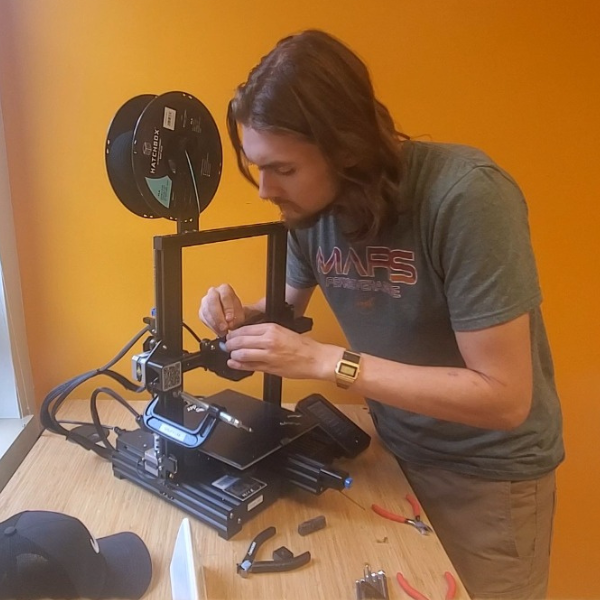 Reign Pagaran working on a lab equipment near a window