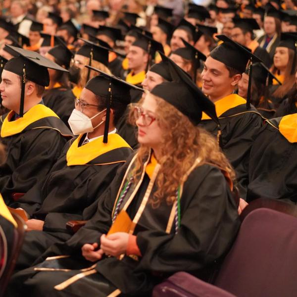 Grads sitting down