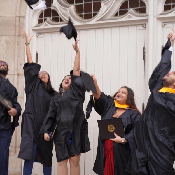 Grads throwing their caps in the air