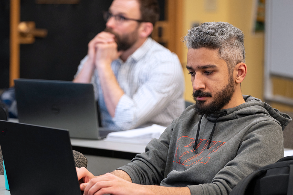 Student working on a laptop in a classroom
