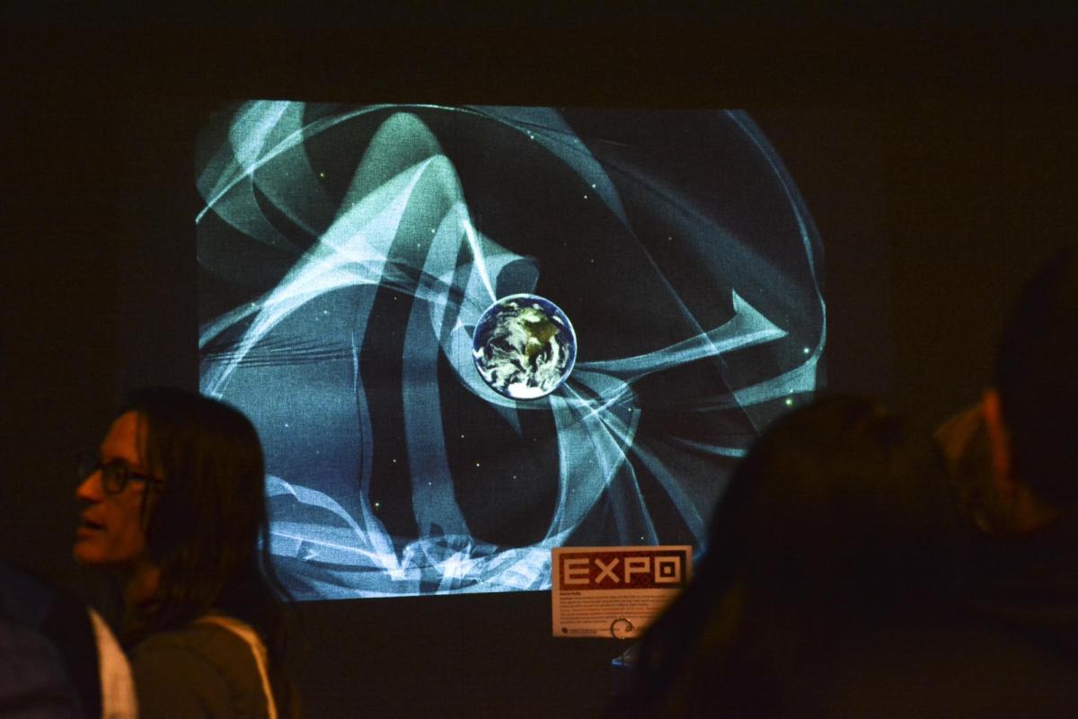 A screen showing an abstract image during the 2017 ATLAS Expo.