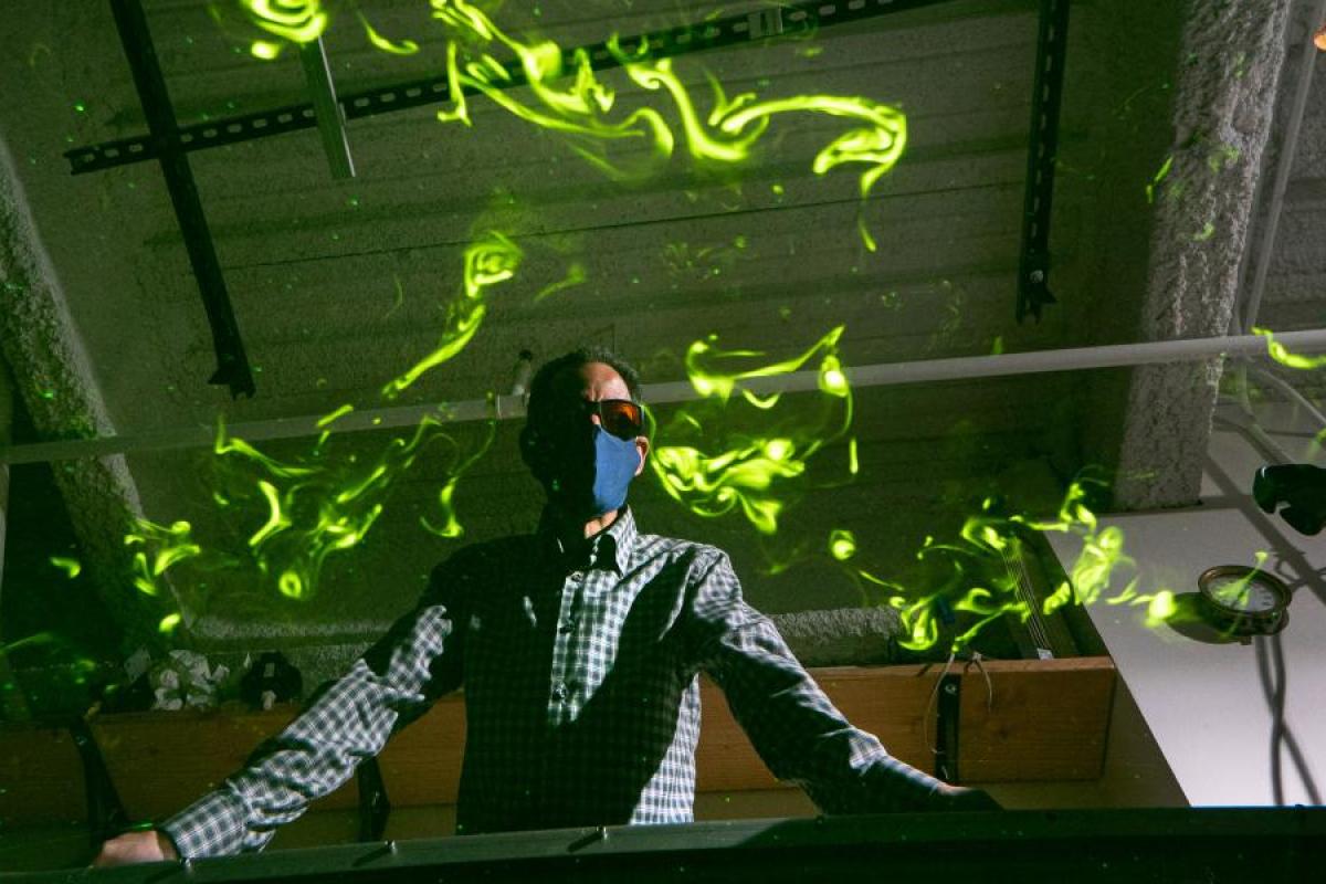John Crimaldi with lasers around him