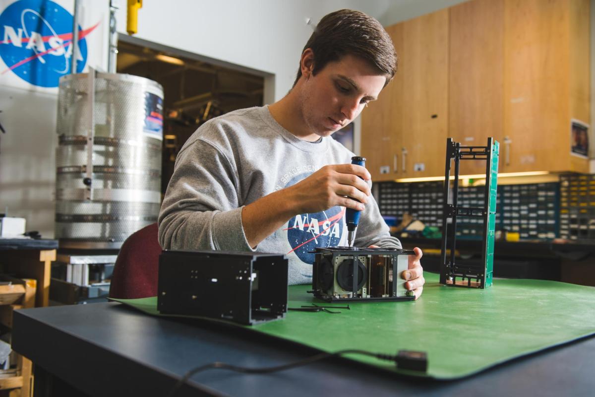 A student works on a project in an aerospace lab.