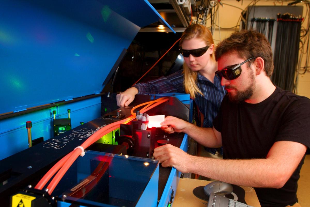 students working with laser