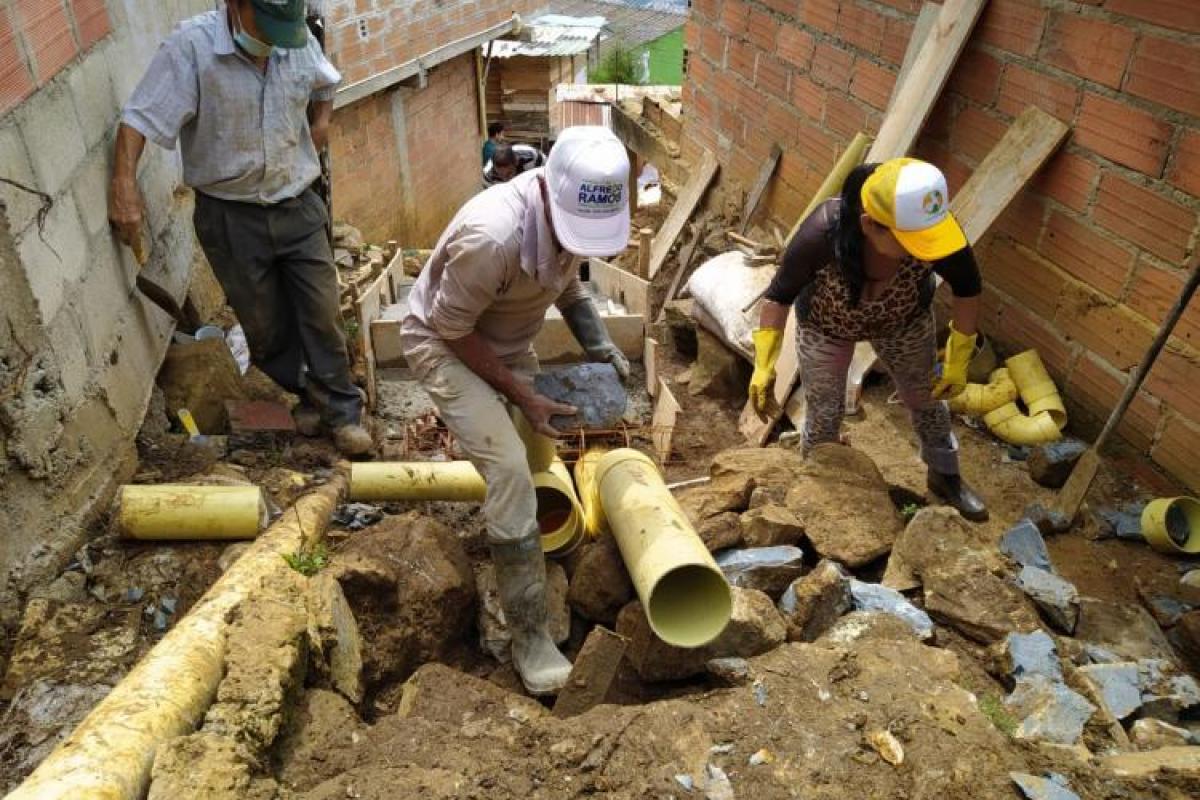 Workers installing pipe