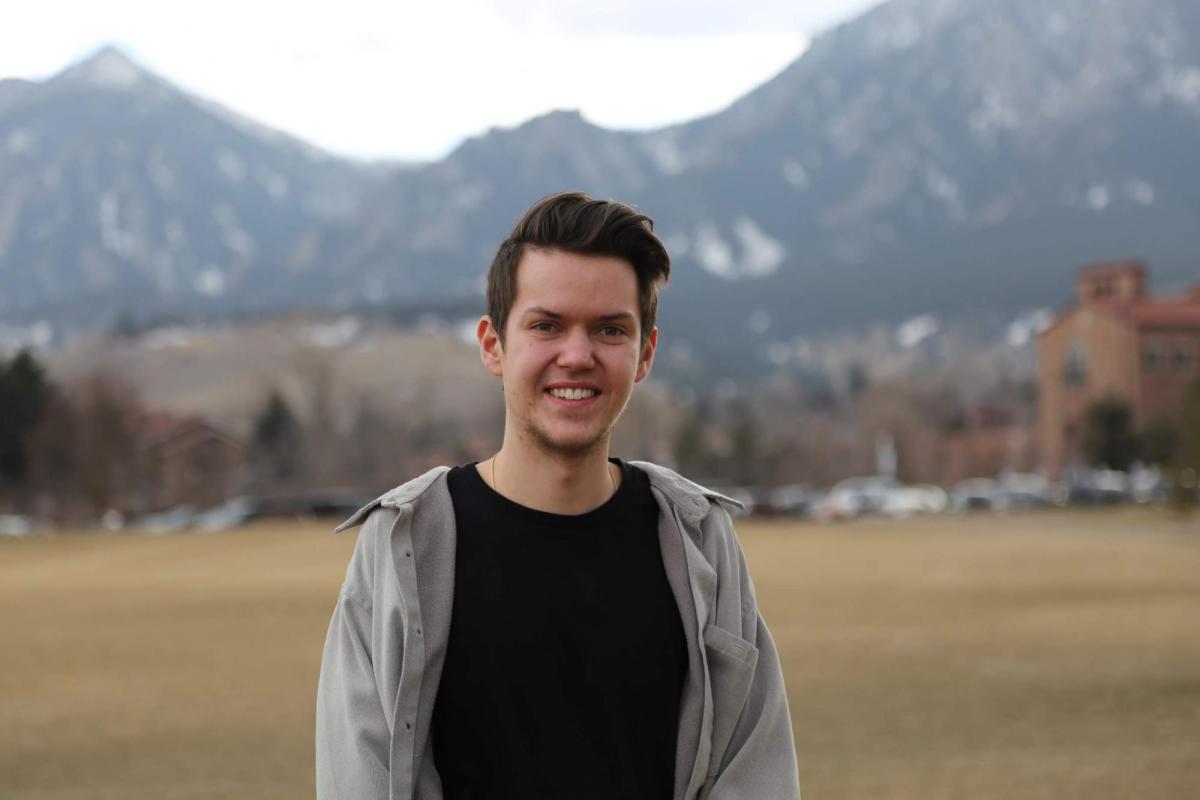 Jonathan Bosnich on the Business Field with the Flatirons in the distance