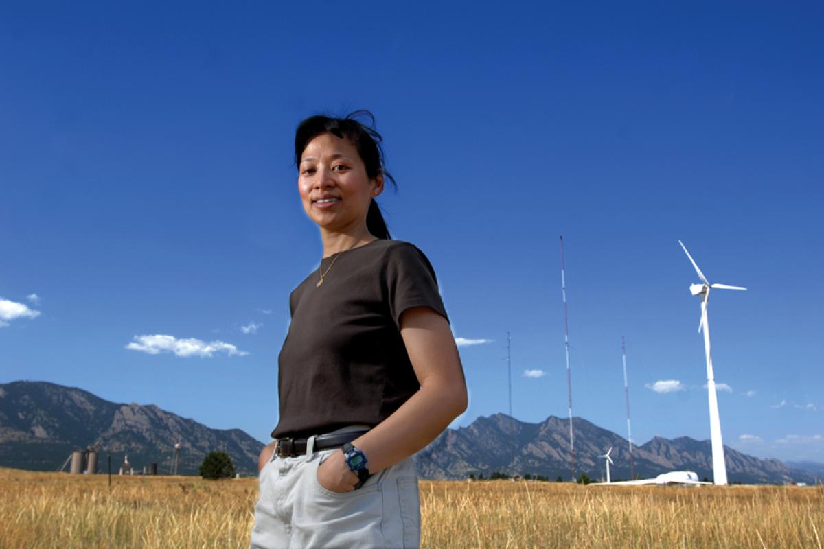 lucy pao, cu boulder faculty at national research lab in front of windmills