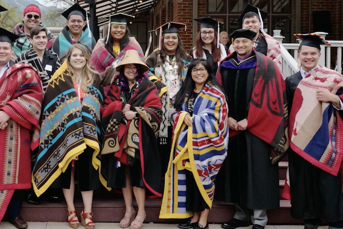 Group of indigenous and native students in traditional garb