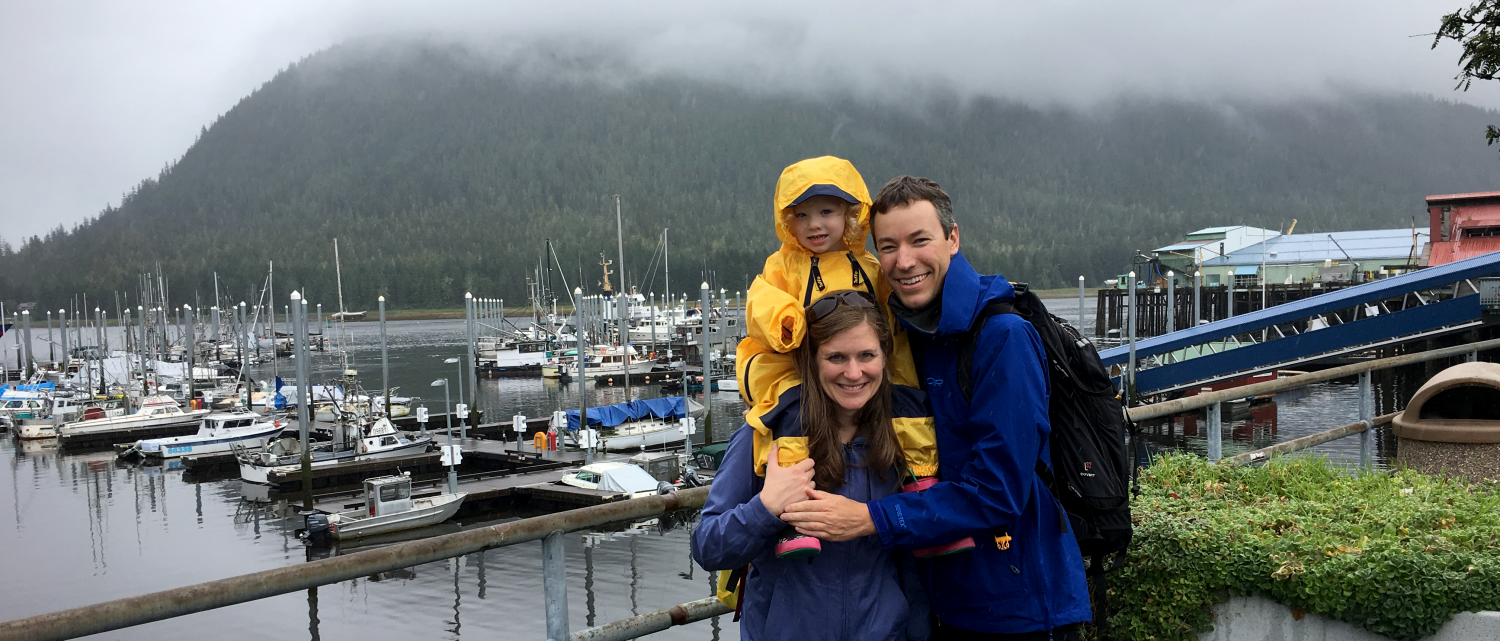 Julie Steinbrenner and her family posing next to boat docks