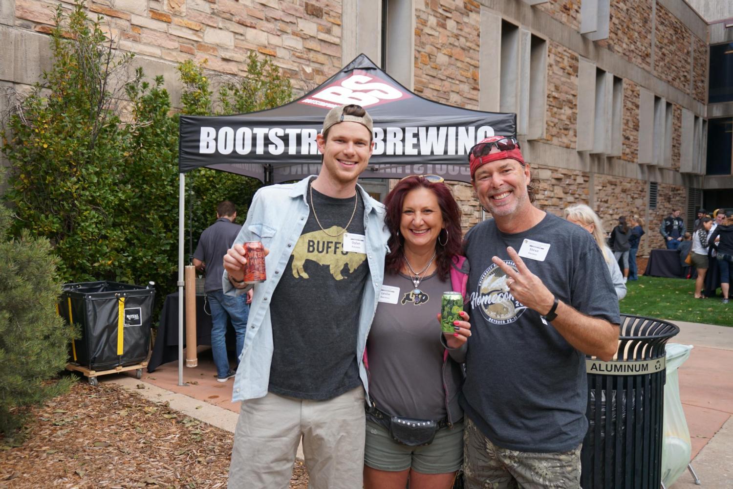 Steve, Leslie and Dylan Kaczeus stand at CU Engineering homecoming tent