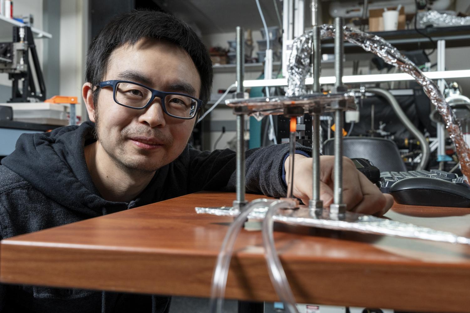 Assistant Professor, Longji Cui, working in his lab.