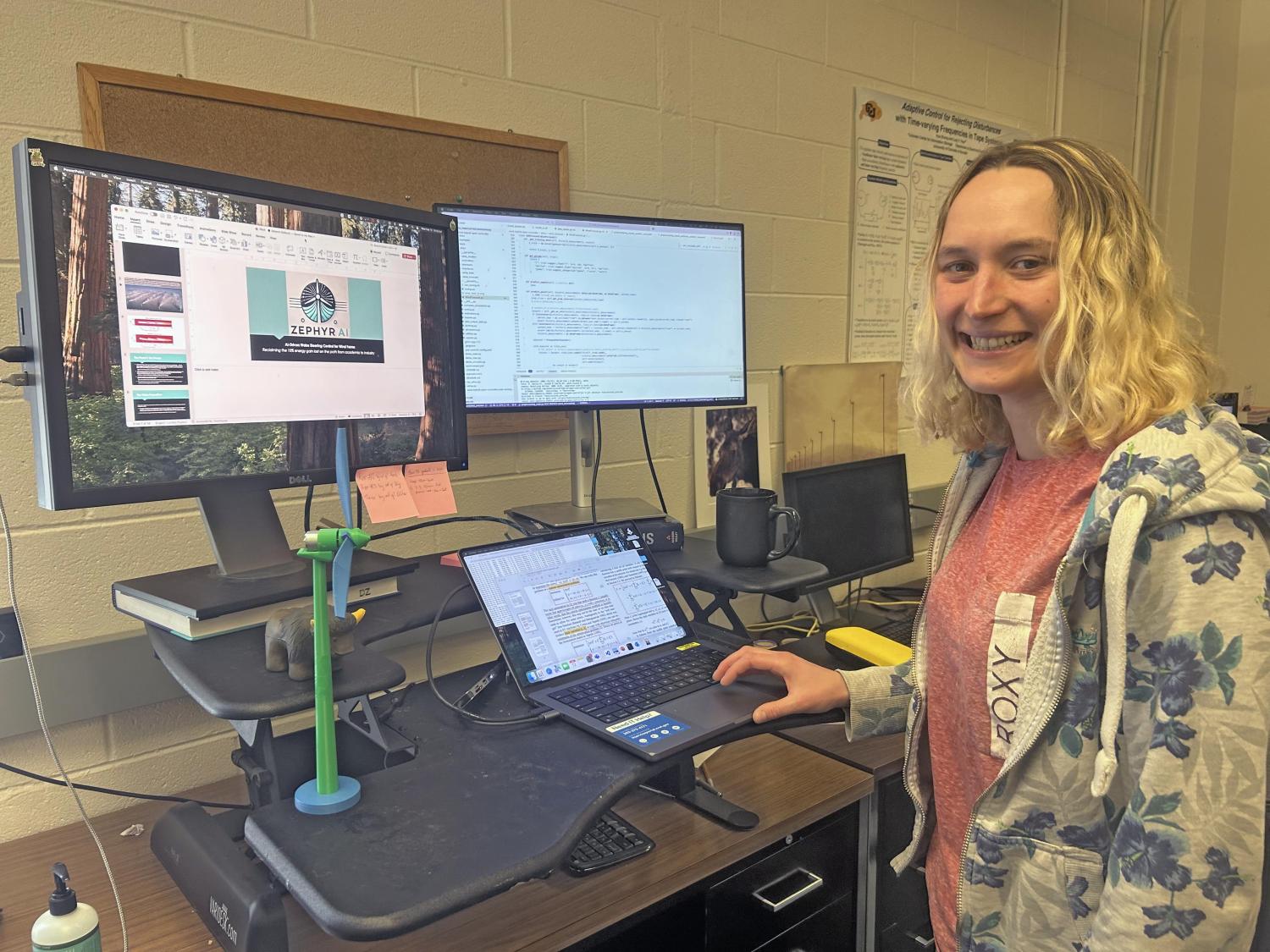 Student sitting in front of a computer and typing.