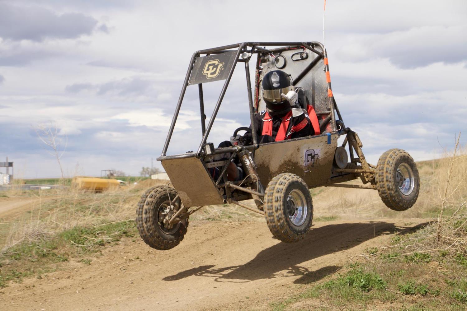 The vehicle getting air on a course.