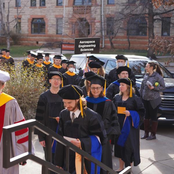 Students walking into graduation