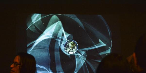 A screen showing an abstract image during the 2017 ATLAS Expo. 