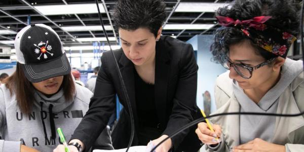 Students and faculty working in the lab