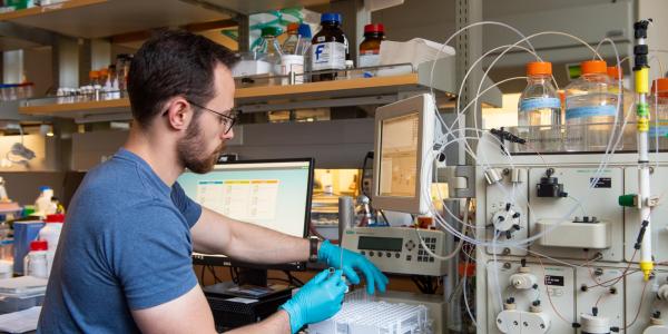 A researcher works in a chemical engineering lab. 