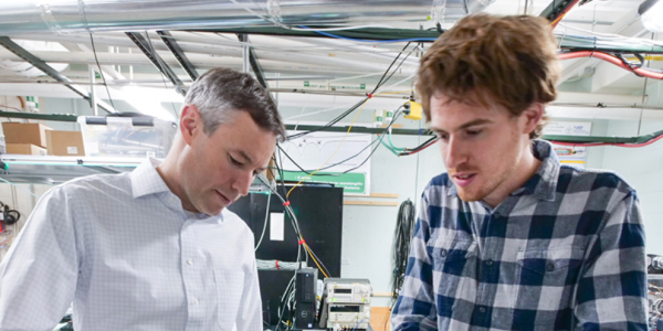 A professor and colleague working in the lab together,