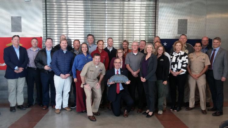 Assistant Dean for Research Bill Doe (center, holding “Beat Navy” sign) and Mike Traxler (far right – CU Office of Industry Collaboration) host the ONR contingent on campus.