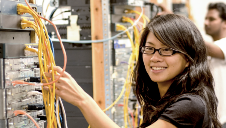 Female student in networking lab.