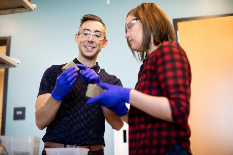 Srubar talking to a student in his lab